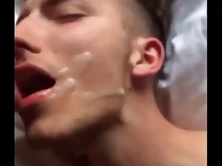 Twink eating cum.